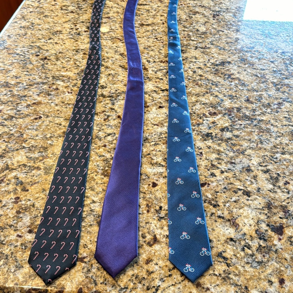 Three mens or teens skinny neckties.